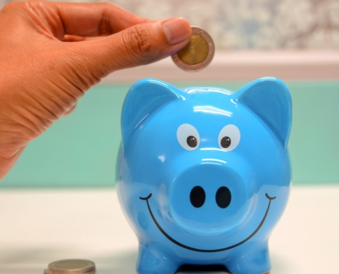 blue-piggy-bank-with coins-RocketChip-best-cars-with-high-mpg-after-installing-a-performance-chip